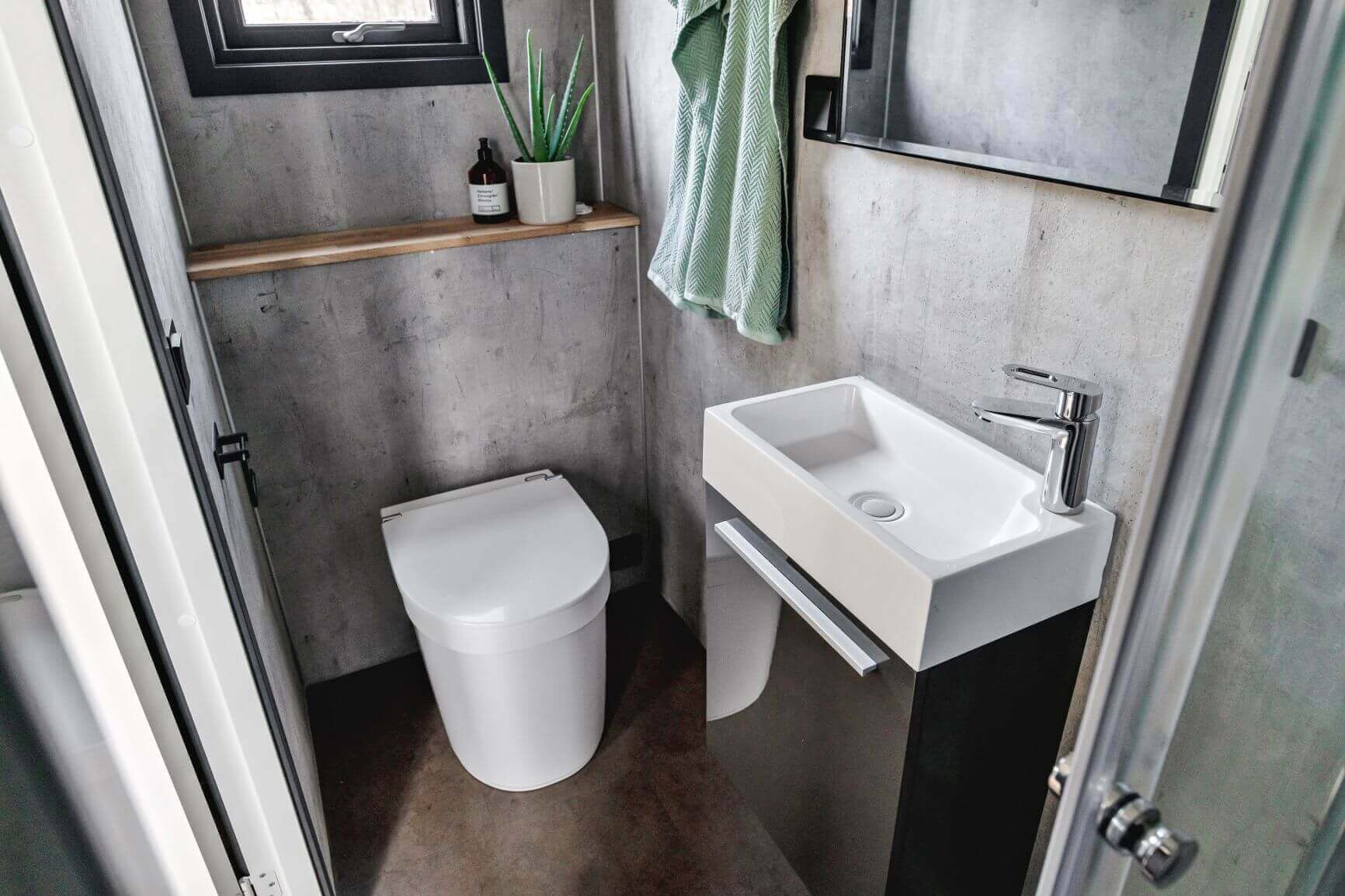 Compact bathroom featuring Separett Tiny 1270 Toilet with Internal Urine Tank, ideal for RVs and tiny homes, available at Cabin Depot.