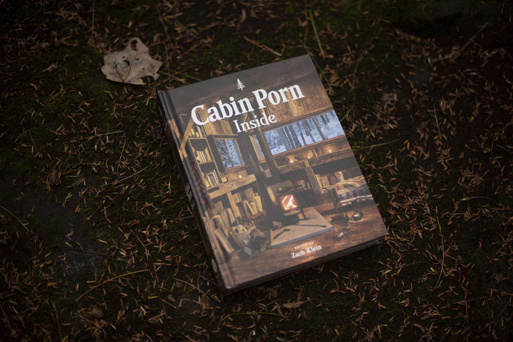 "Cabin Porn Inside book on forest ground, inspiring tranquil cabin and handmade home designs"