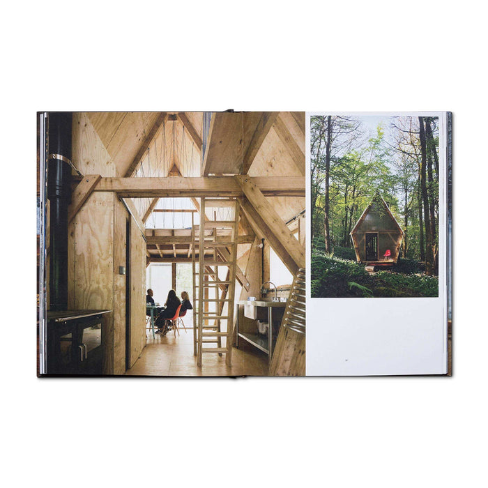 "Cabin Porn Inside Book open to page showing interior and exterior of a tranquil wooden cabin in the forest"