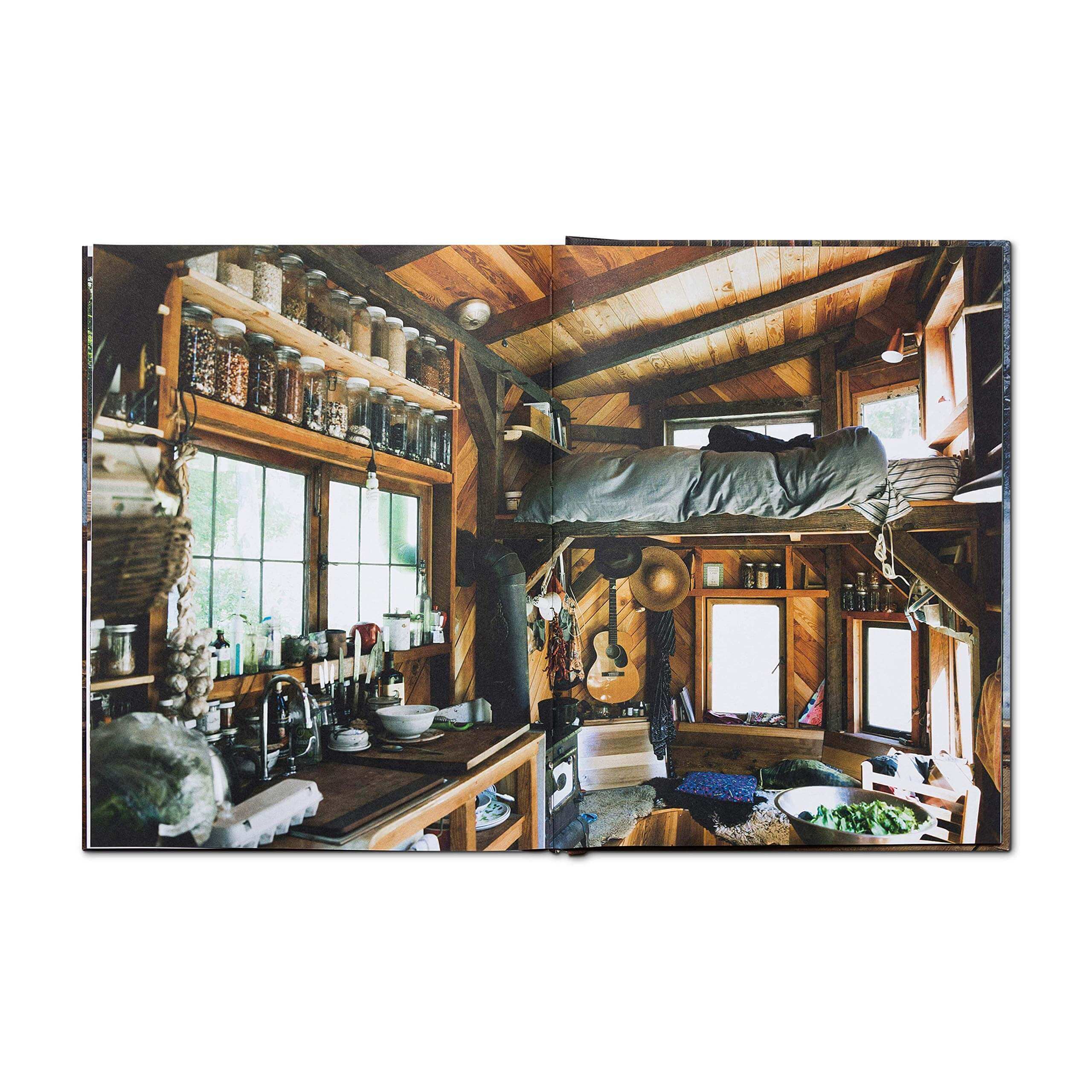 Cozy wooden cabin interior from Cabin Porn Inside book, showcasing a tranquil homemade lifestyle. Discover more at Cabin Depot.