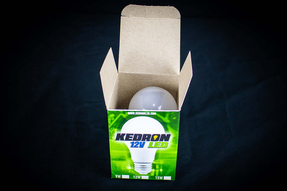 Kedron 12V 9W LED DC Light Bulb in open box, E26/E27 socket, 6500K cold white variant, available at Cabin Depot.