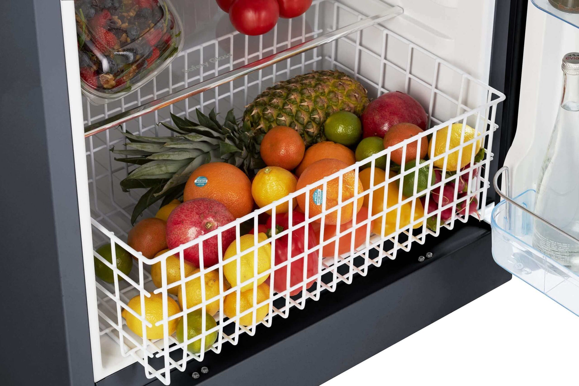 Interior of Unique 14 Cu/Ft Propane Fridge with fruit basket, showcasing spacious storage from Cabin Depot.