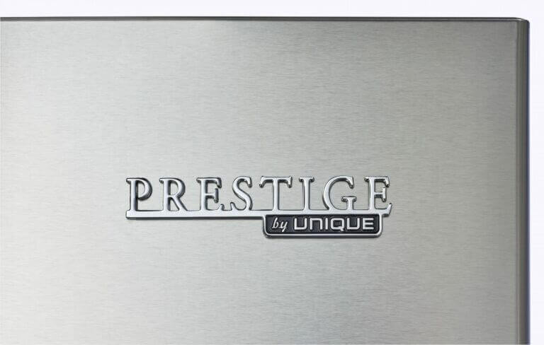Prestige stainless steel logo on Unique Appliances refrigerator at Cabin Depot.