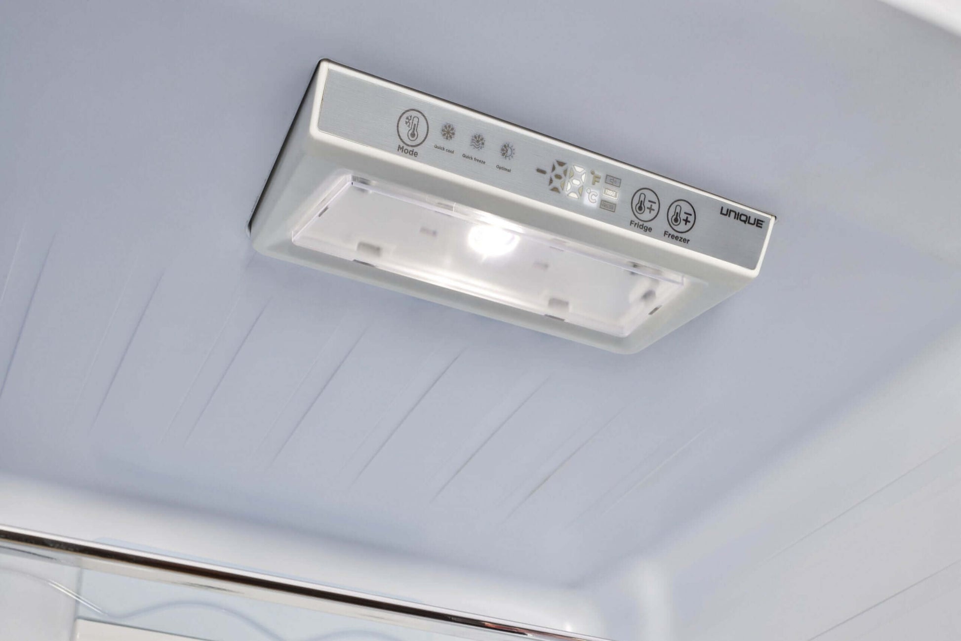 Interior view of Unique 12 Cu/Ft Classic Retro Electric Bottom Mount AC Refrigerator light, available at Cabin Depot.