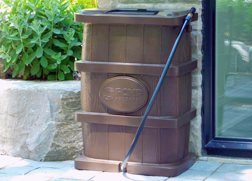 FCMP Outdoor Wood Grain Rain Barrel, slim design with linking kit, ideal for compact spaces by downspouts, shown outdoors.